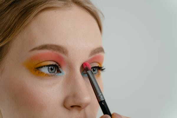 Woman Applying Eye Shadow